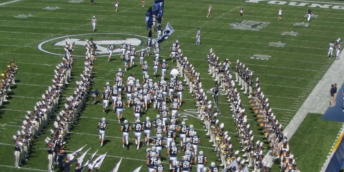 BYU football players entering LaVell Edwards Stadium, used as real editorial imagery for BYU Sport Nuts.