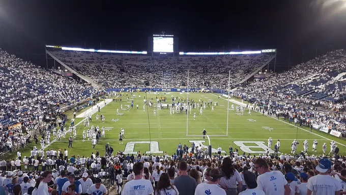 BYU football players line up during a game, used as licensed editorial imagery for BYU Sport Nuts.