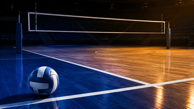 Original editorial illustration of one blue-and-white volleyball on an empty indoor court beneath a net after a night match.