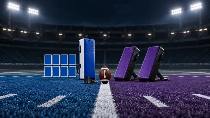Original editorial image of eight blank blue roster markers, a blue blocking pad and kickoff tee opposite two purple rush pads around one football.